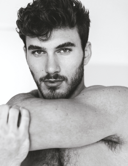 A photograph of a male model posing