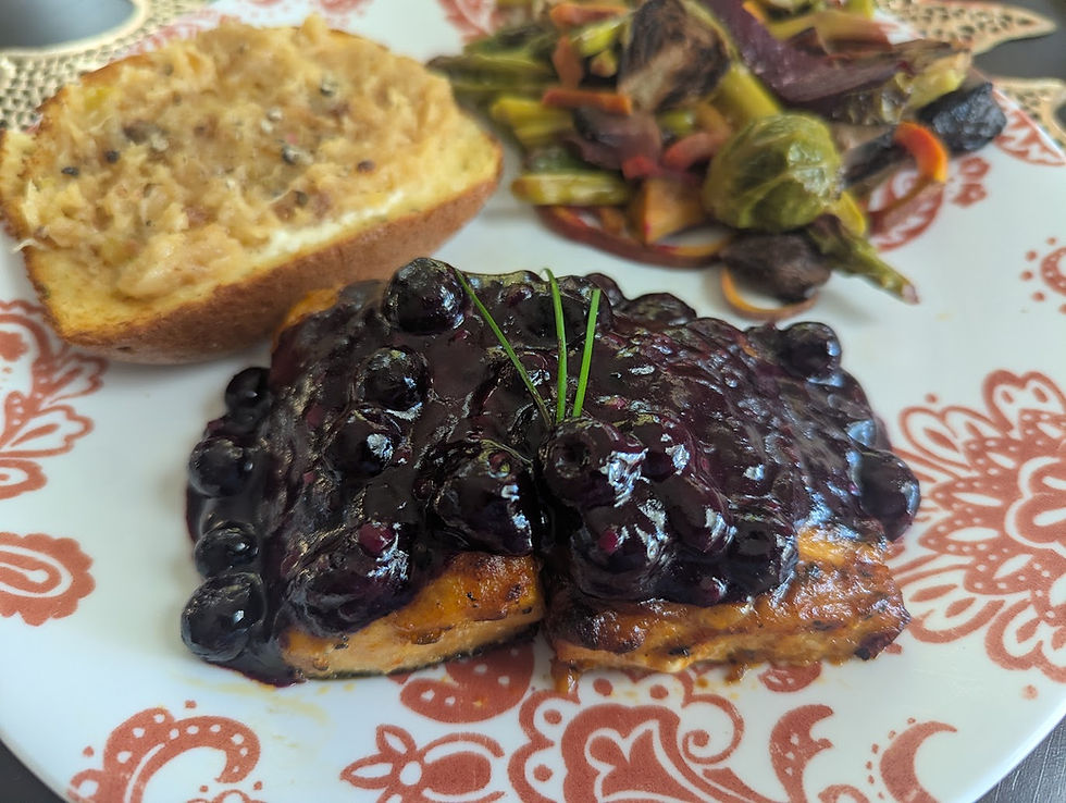 salmon with blueberry sauce and garlic toast and roasted vegetables
