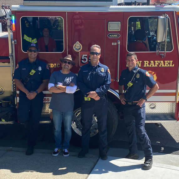 San Rafael firefighters posing in front of a fire engine