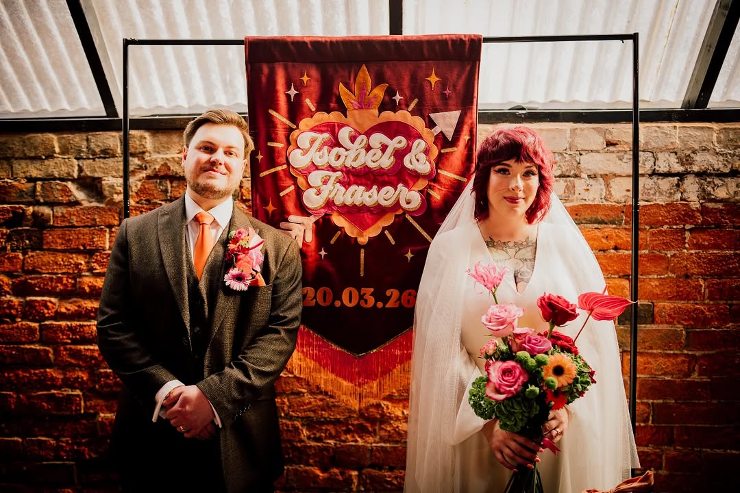 alternative wedding decor, alternative wedding stylists, pink and orange wedding styling, The Shack Revolution wedding venue, bold colourful wedding flowers, Streamadelica ceiling streamers, rockstar wedding welcome sign, burgundy and peach wedding colours, non-traditional wedding design, vibrant wedding photography UK