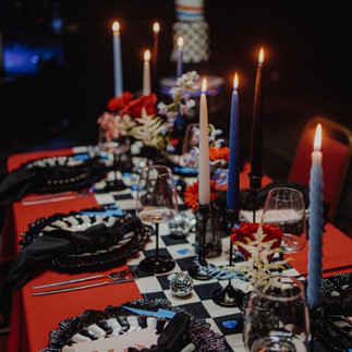 Alternative wedding flowers styled in a bold, sculptural floral installation using vibrant colours and non-traditional textures