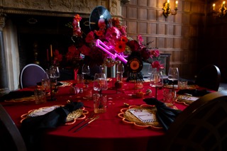 Alternative wedding flowers styled in a bold, sculptural floral installation using vibrant colours and non-traditional textures