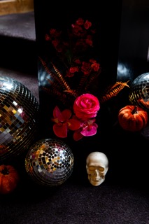Alternative wedding flowers styled in a bold, sculptural floral installation using vibrant colours and non-traditional textures