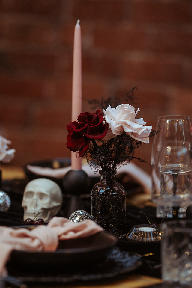 Alternative wedding flowers styled in a bold, sculptural floral installation using vibrant colours and non-traditional textures
