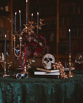 Gothic Wedding Tablescape with Green Damask Tablecloth, Gold Candleabra and Skull. Also fe