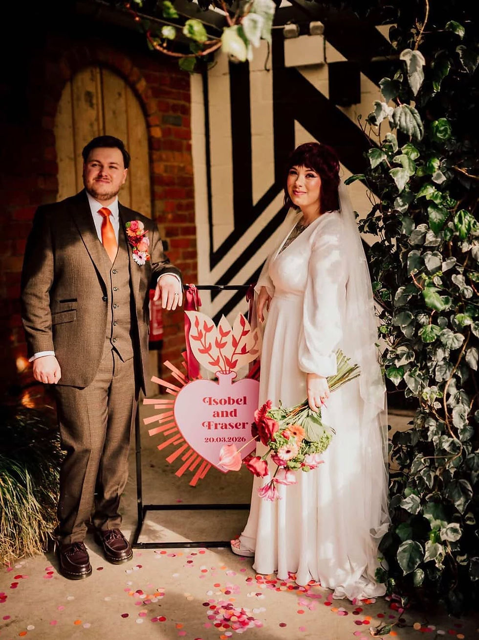 alternative wedding decor, alternative wedding stylists, pink and orange wedding styling, The Shack Revolution wedding venue, bold colourful wedding flowers, Streamadelica ceiling streamers, rockstar wedding welcome sign, burgundy and peach wedding colours, non-traditional wedding design, vibrant wedding photography UK