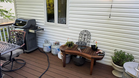 Spotless deck with clean outdoor furniture, presenting a tidy and inviting outdoor living area.