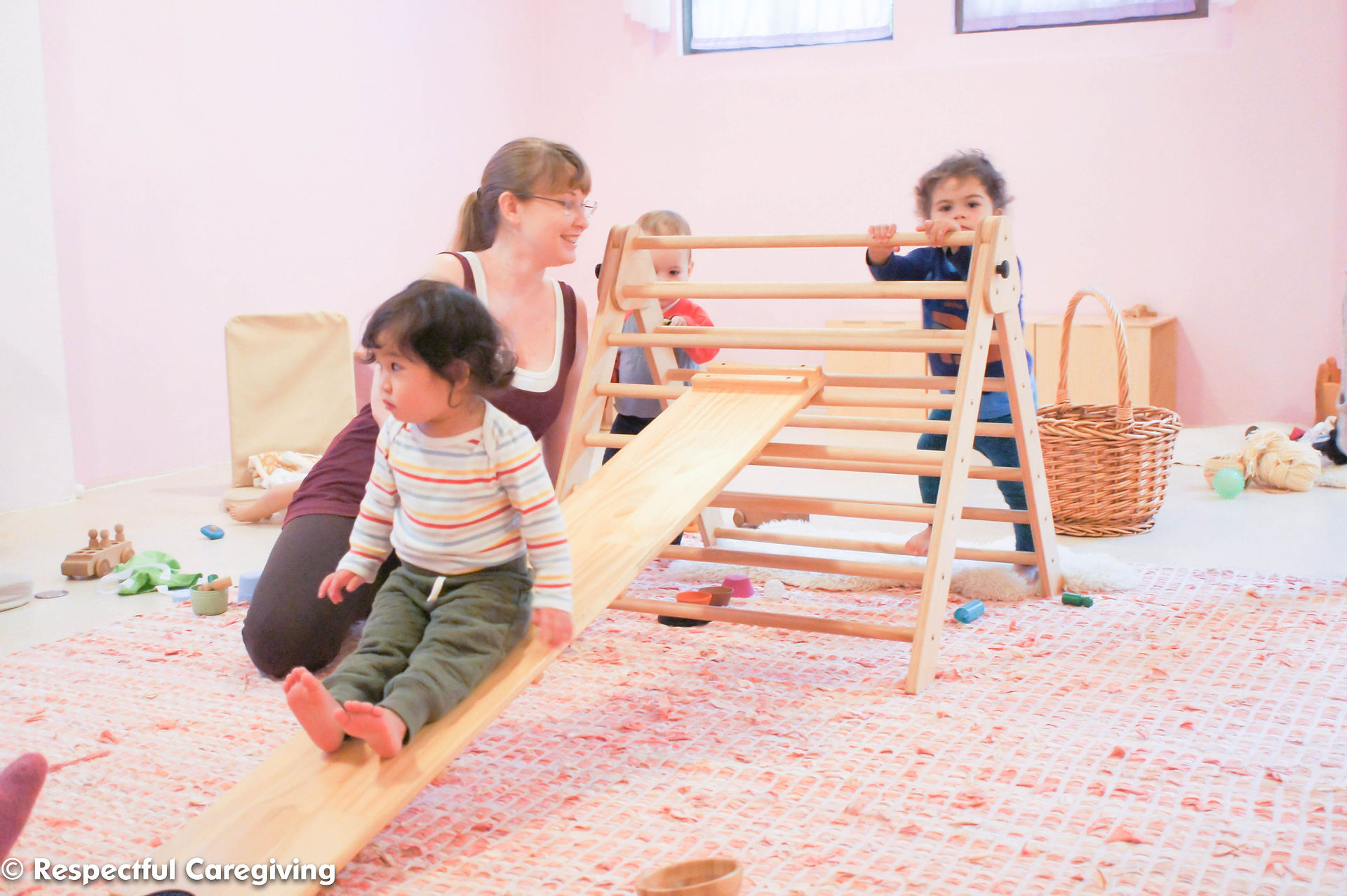 These toddlers have mastered this structure when playing independently. They only need my spotting to make sure they can navigate the space without pushing each other off the ramp.