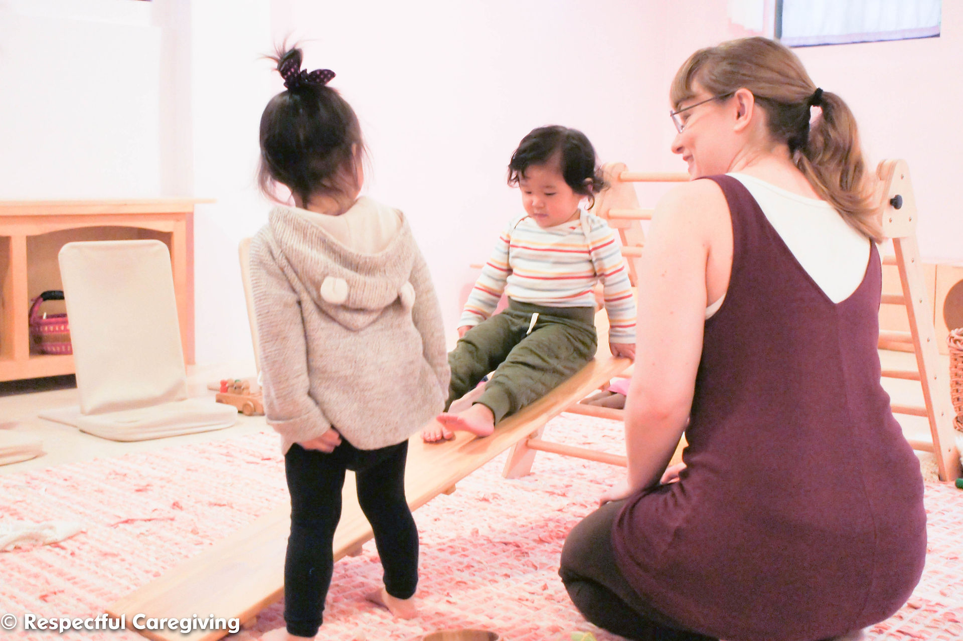 These toddlers have mastered this structure when playing independently. They only need my spotting to make sure they can navigate the space without pushing each other off the ramp.