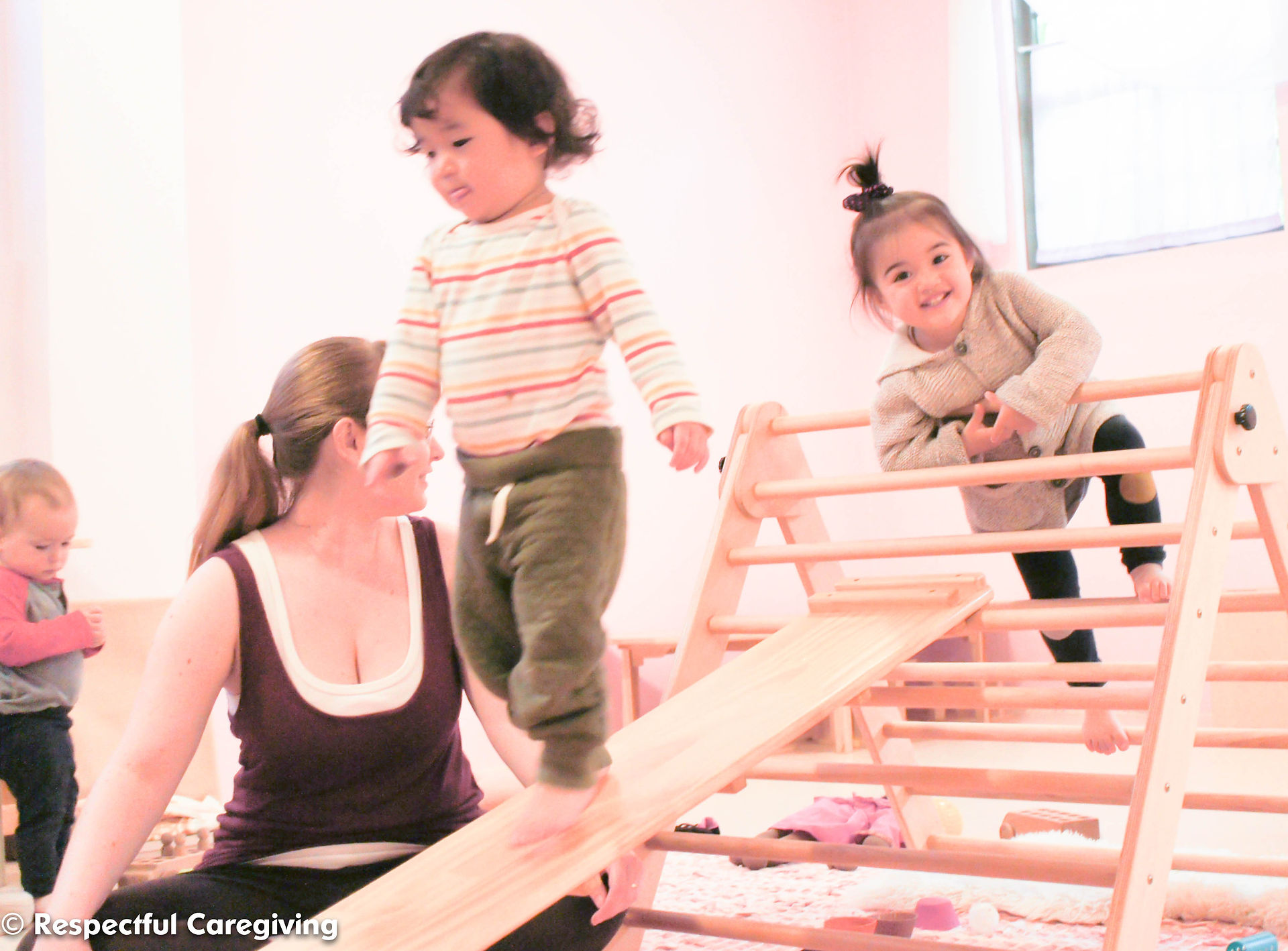 These toddlers have mastered this structure when playing independently. They only need my spotting to make sure they can navigate the space without pushing each other off the ramp.