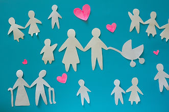 Paper cut outs of different family structures on a blue background.