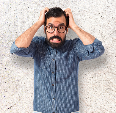 frustrated Young hipster man over textur