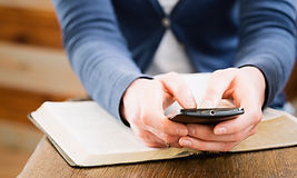 Female hands holding a mobile phone over