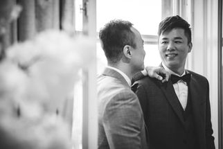 Dennis and Derek smiling at their Edinburgh wedding