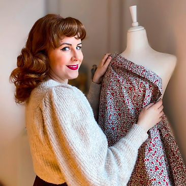 Carissa DeLaine posing with her mannequin
