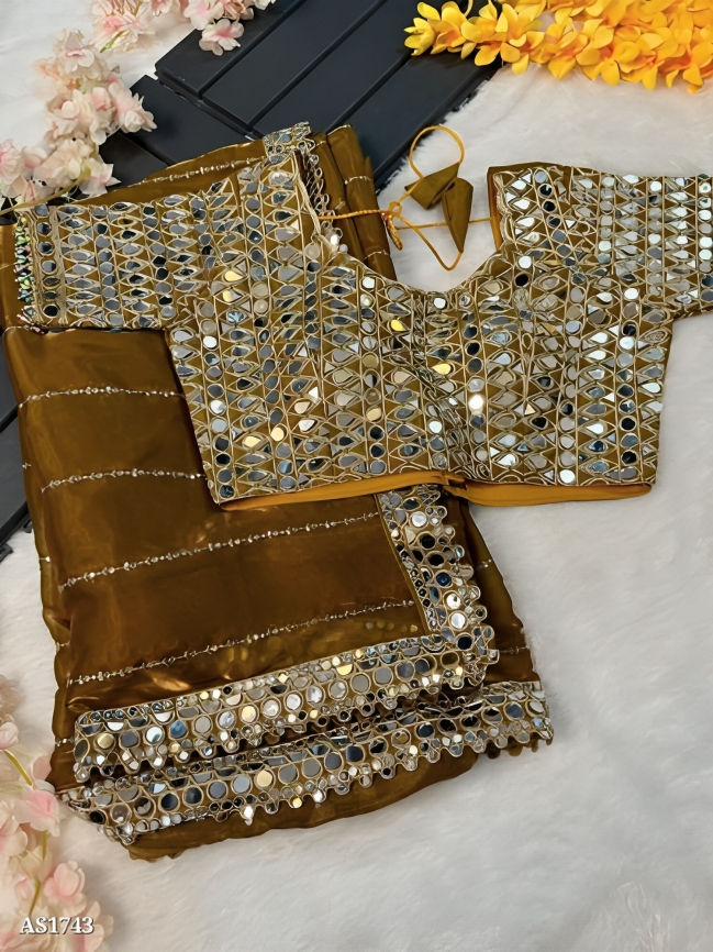 A golden satin organza saree