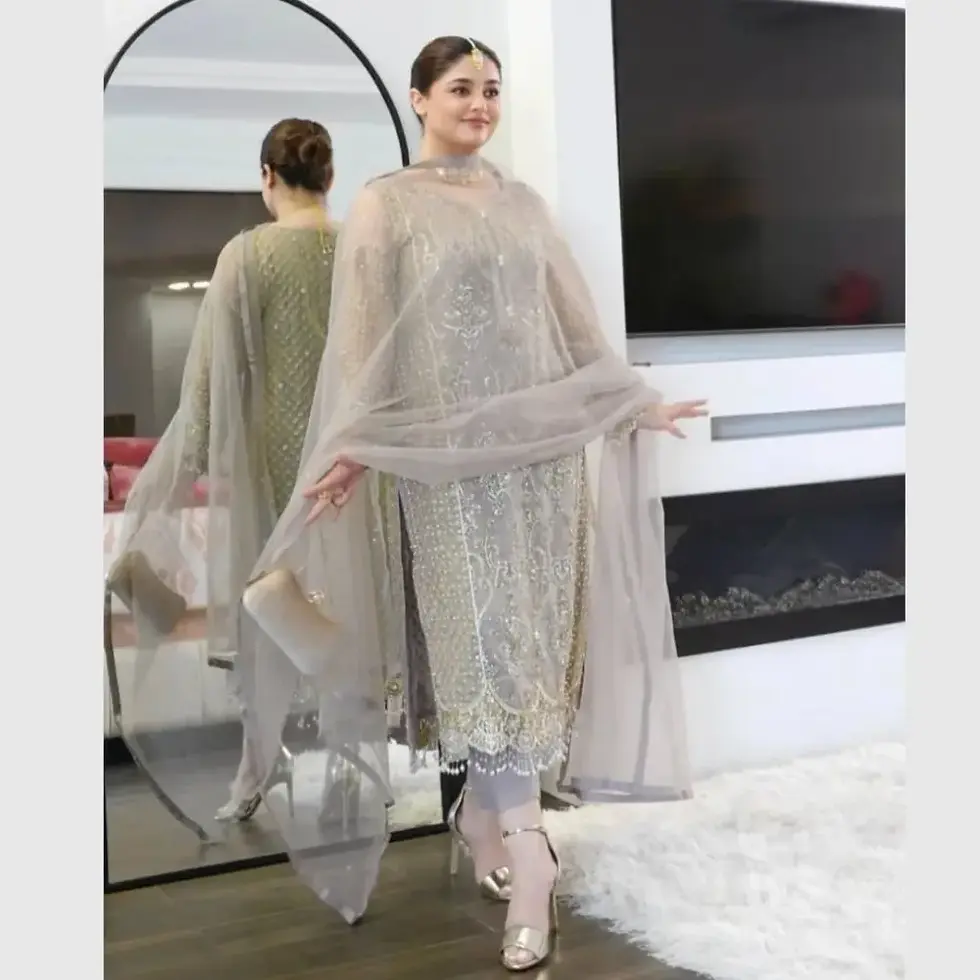 A Women in Pakistani Designer Suit in Soft Net Sequence Embroidered & Lace Border Dupatta