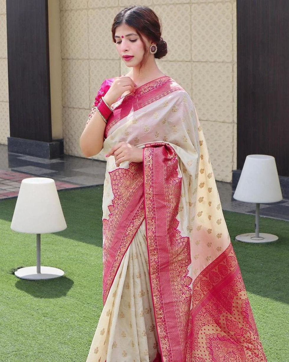 A Women in Mesmerizing Floral Printed Banarasi Woven Silk Saree with Contrast Border