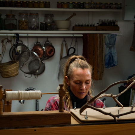 Woman sitting in her creative studio