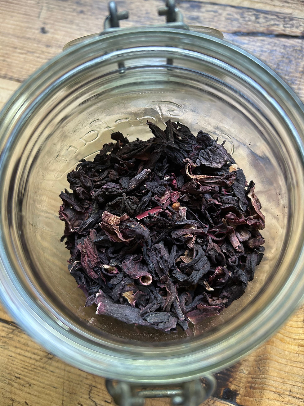 dried red flowers in a glass jar