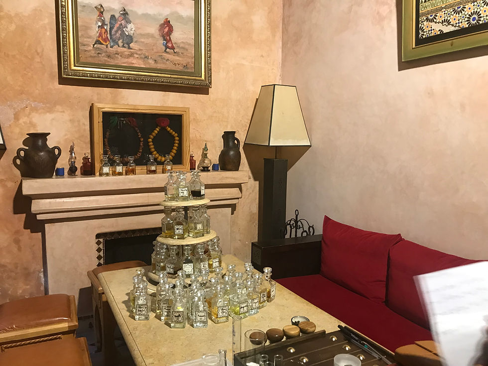 room with pictures and lamp, bottles of perfume