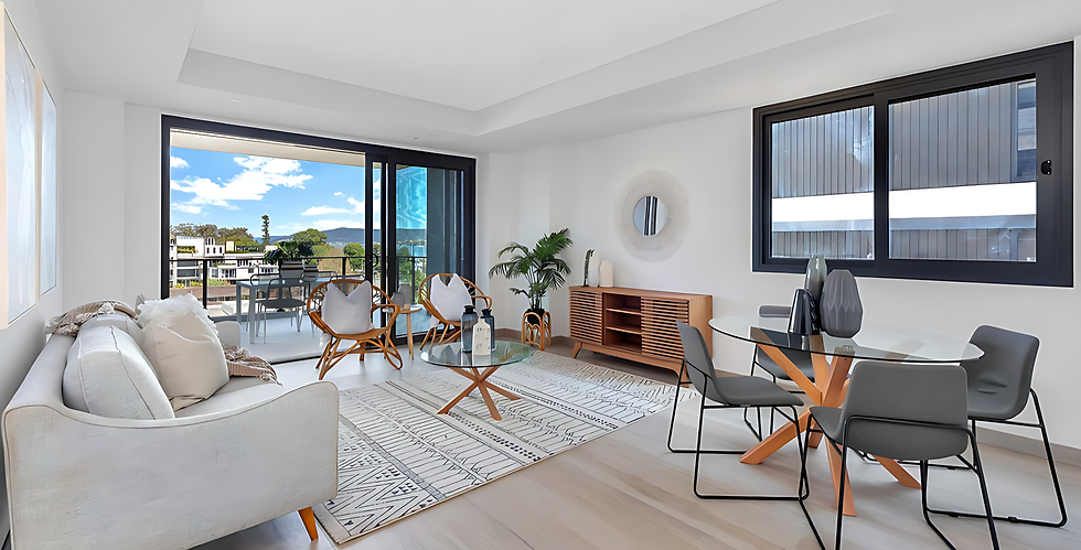 Living room interior with waterfront view, furniture, and decor. 19TEN Design.