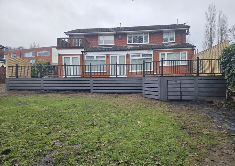 Raised NewTechWood composite decking installation in Prescot garden