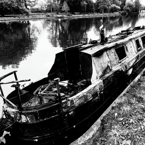 Monochrome minimalist photograph of a burnt out barge.
EXCELLENT RESOLUTION TO 80x60CM