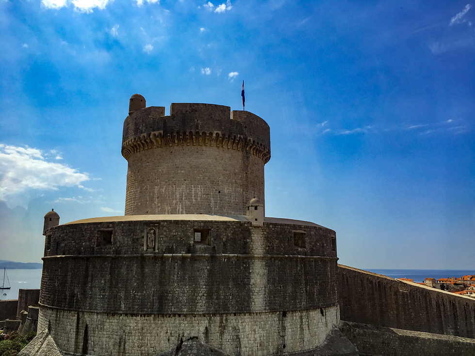 Round Minčeta Tower at the high corner of Dubrovnik's city walls against a blue sky