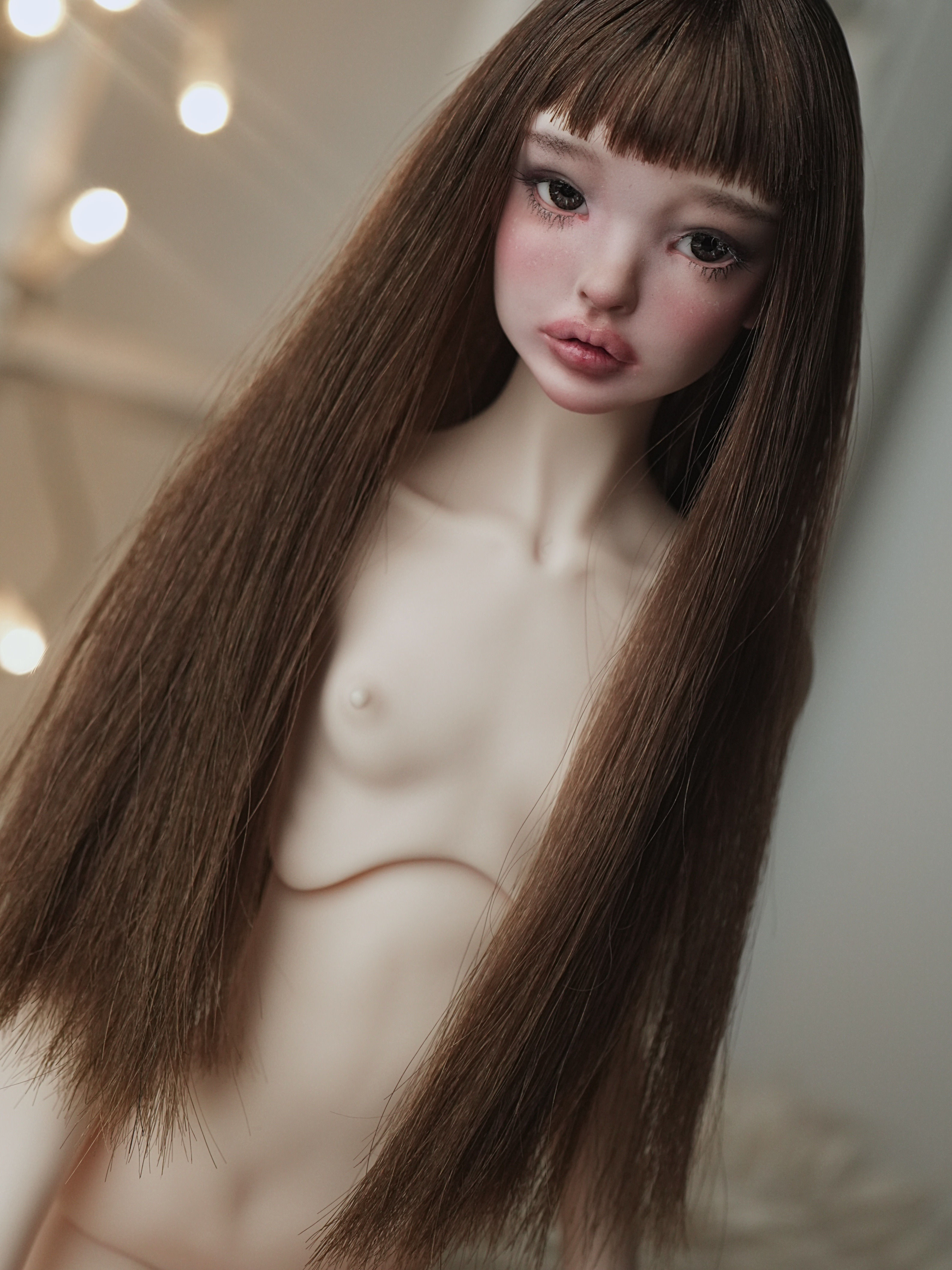 Handmade alpaca wig with long blunt straight hair and full bangs.