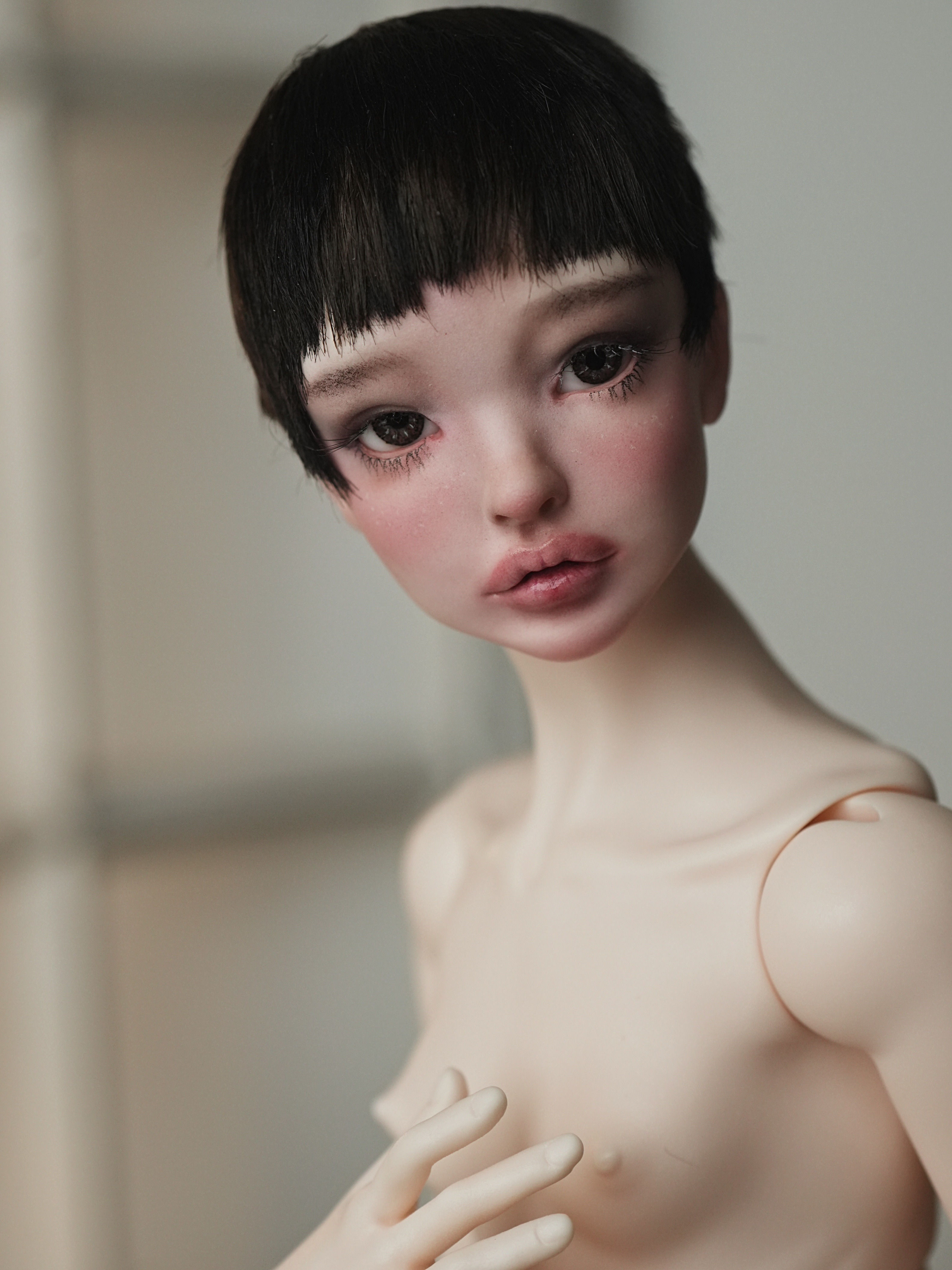 Handmade alpaca wig with a short pixie cut and blunt bangs.