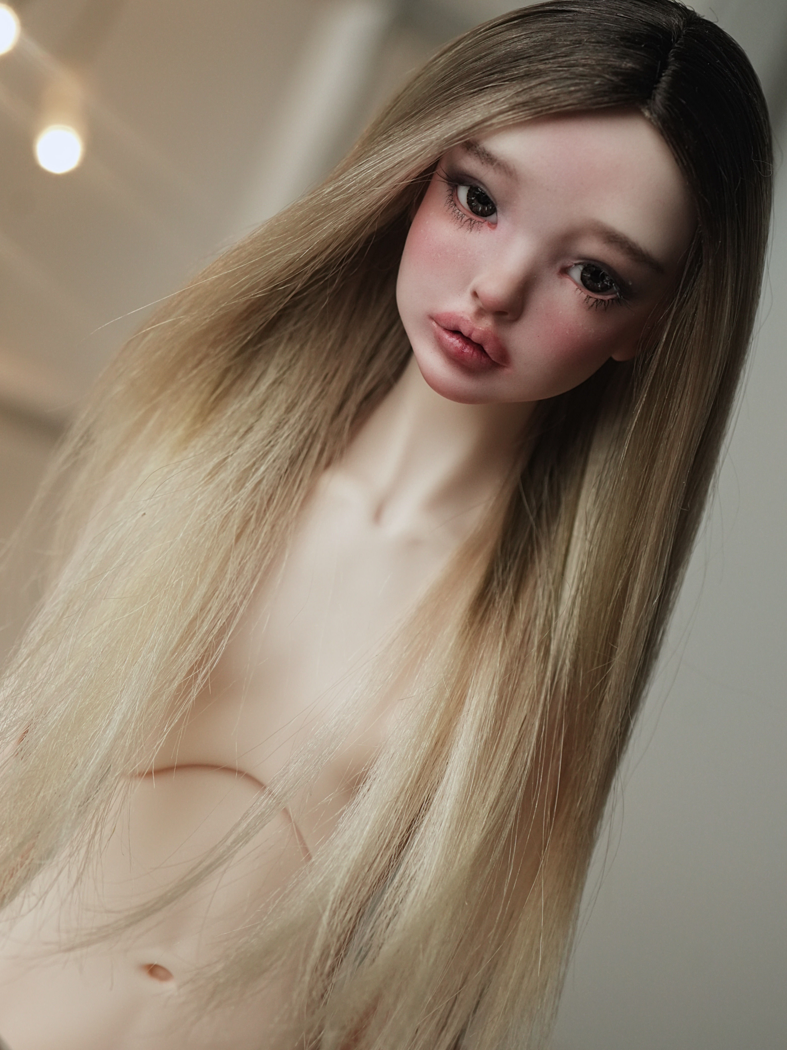 Handmade angora goat hair wig with a long straight lob.
