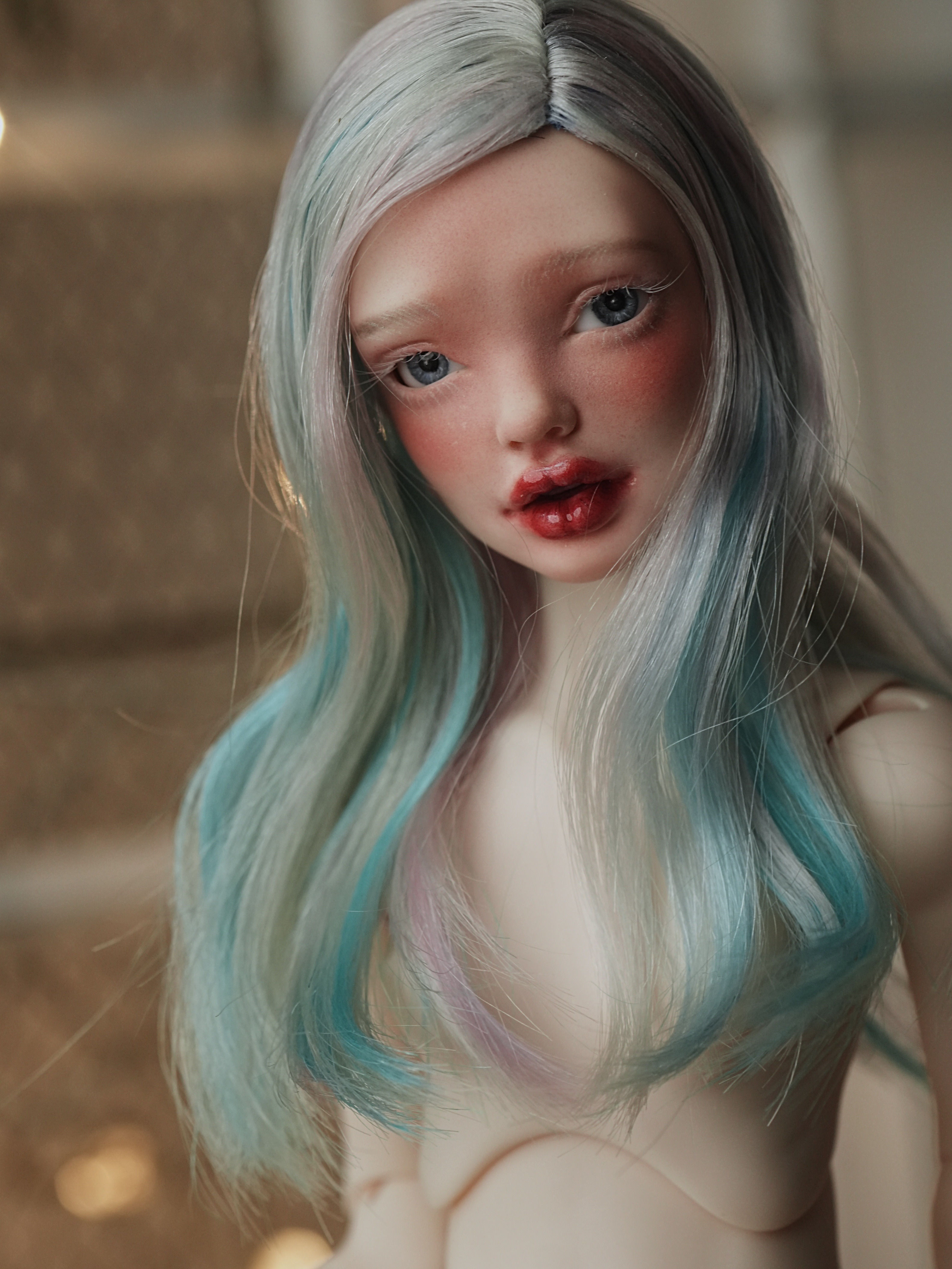 Handmade angora goat hair wig with a medium-length smooth wavy lob.