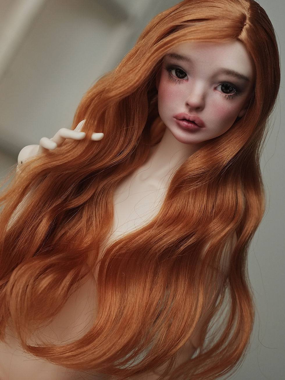 Handmade angora goat hair wig with long smooth waves.