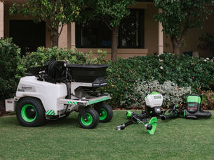 Greenworks Commercial 82-volt battery-powered Optimus SP952 sprayer and spreader unit with handheld equipment on a residential lawn in Perth, used by Positively Green professional greenkeepers.