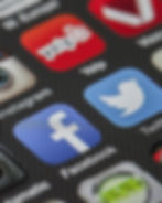 Apps Facebook, Yelp, Instagram, and Twitter icons on a smartphone screen.