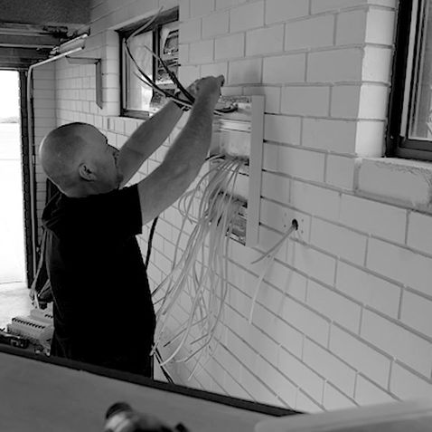 Licensed electrician from WA Sparkies rewiring a home during a full renovation in Perth