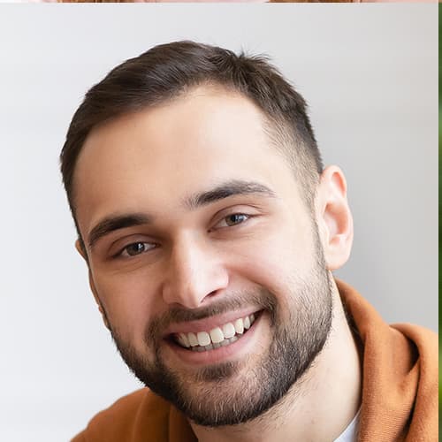 Smiling man with short brown hair