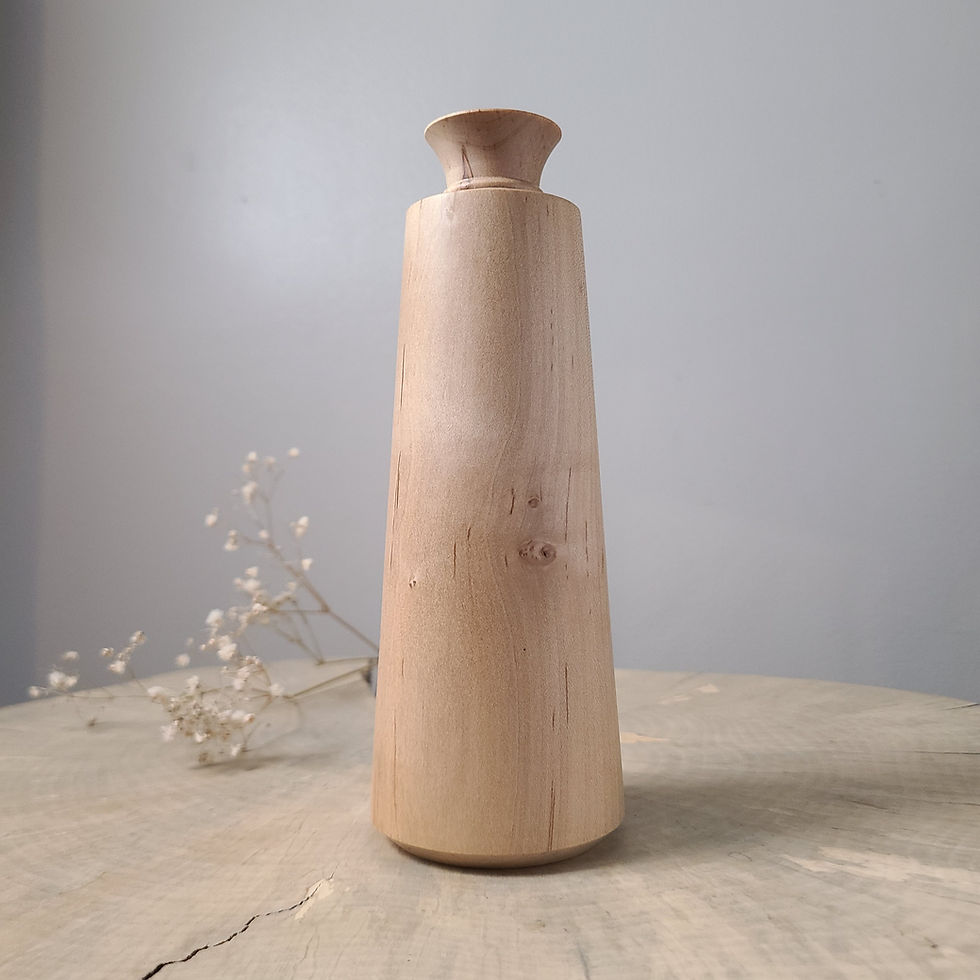 Thumbnail: Handcrafted tall maple bud vase with a softly flared rim and natural grain detail, styled on a rustic wooden surface with a n