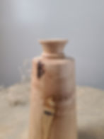Handcrafted maple bud vase with natural bark highlighting raw textures and organic beauty