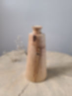 Handcrafted maple bud vase with natural bark highlighting raw textures and organic beauty