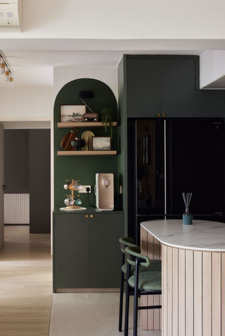 494J Tampines St 45 - Mid-century modern dry pantry in a 4-room BTO in Singapore, designed by Comfort Home Interior, featuring light wood cabinetry with seamless, handle-less doors. The open shelving unit with vertical wooden slats displays glassware and ceramic dishes, adding depth and warmth to the minimalist design. The lights are off, highlighting the sleek, organized kitchen environment.