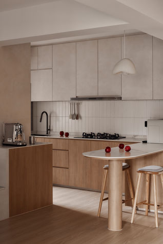 Modern Scandinavian kitchen with natural lighting, white cabinetry, wood accents, and a marble countertop in a 4-room BTO at 123A Tengah Drive