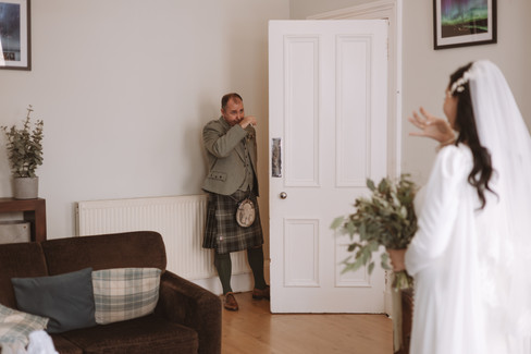 First look with brides dad on the morning of the wedding 