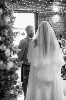 Bride and groom during the ceremony at The Engine Works in Glasgow