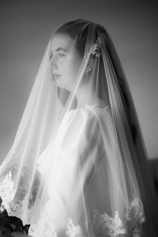 Bridal portraits at The Engine Works in Glasgow with veil over the brides face 