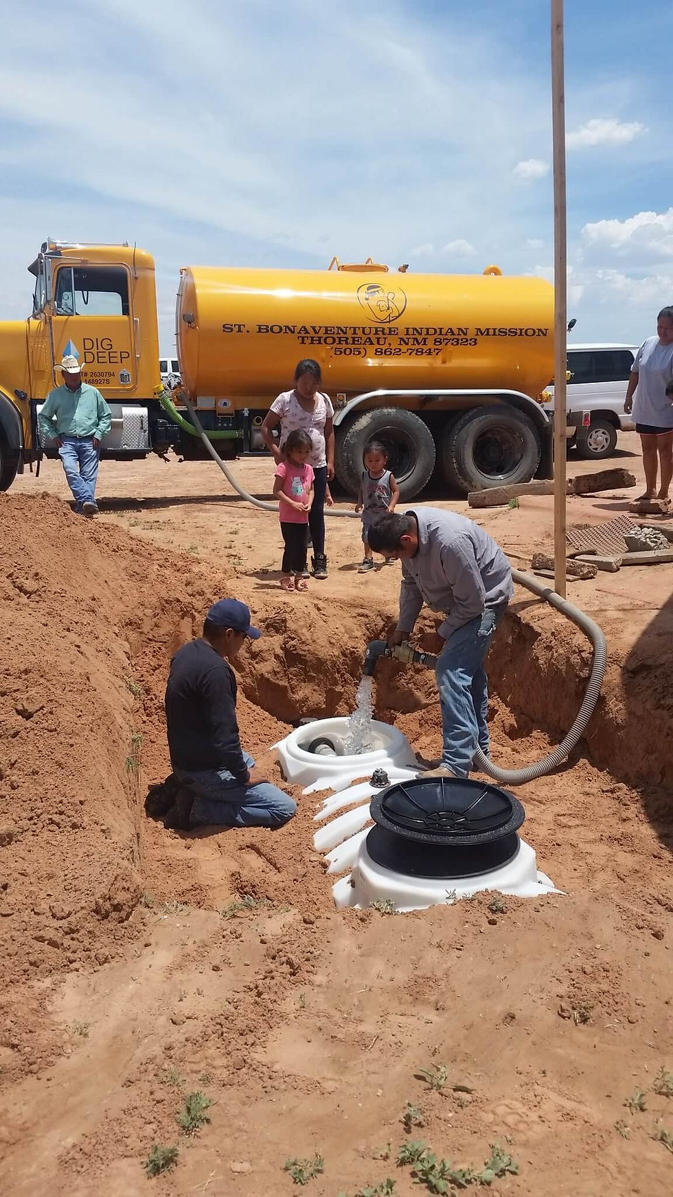 Filling an underground tank as part of the Navajo Water Project. ©DigDeep
