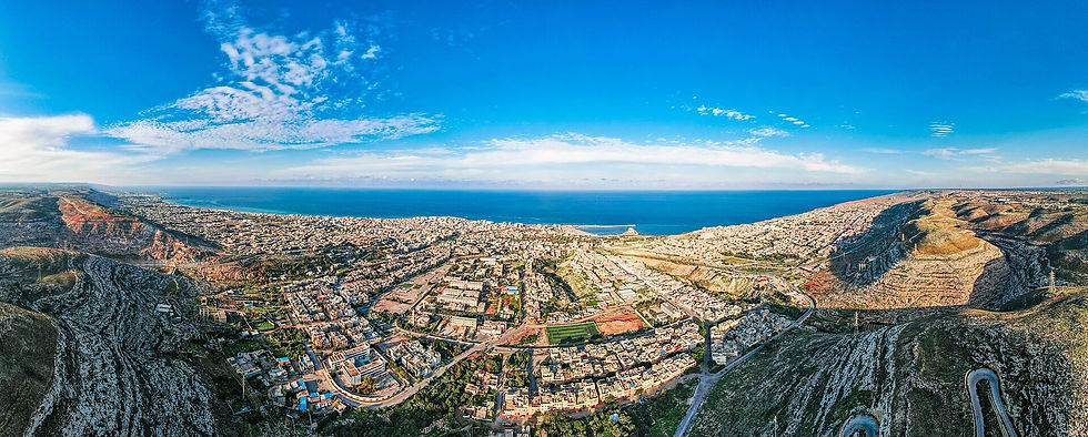 A panoramic view of the Mediterranean city of Derna, Libya, in 2020. In September 2023, Storm Daniel caused two upstream dams to burst, sending a wall of water down the narrow wadi around which the city is built, destroying a large portion of the metropolis. Maherlink/Wikipedia
