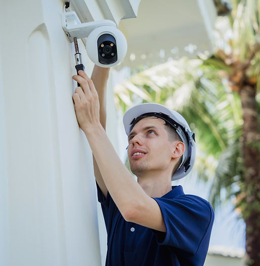 technician-installs-cctv-camera-facade-residential-building.jpg