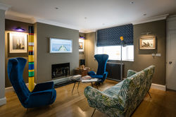 The basement TV space is cosy and stylish, the Mid-Century Modern pieces are all original